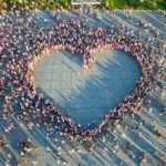 Drone,View,Of,Women,Who,Formed,A,Huge,Heart,Shape