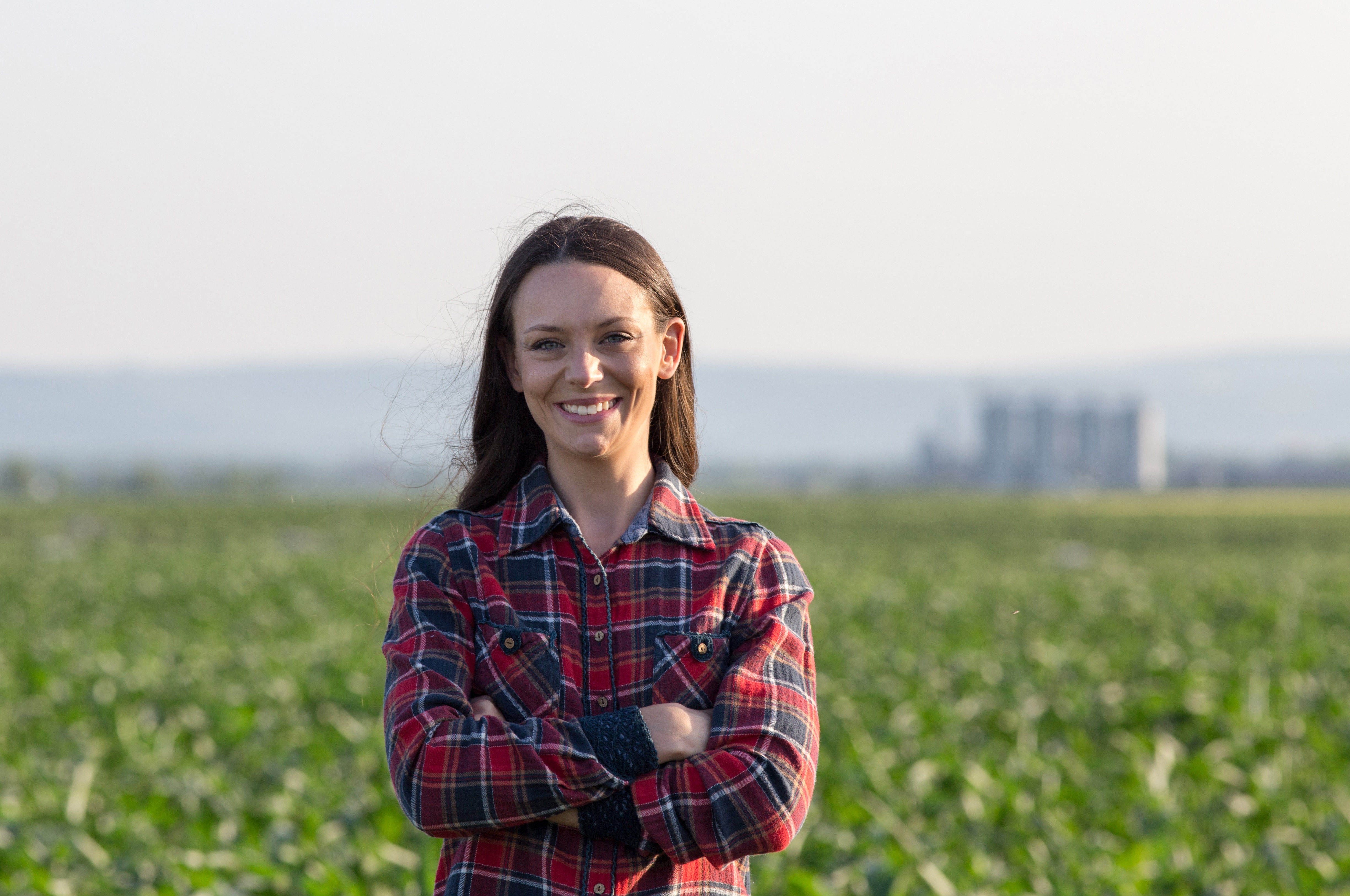 Portrait,Of,Pretty,Young,Farmer,Woman,With,Crossed,Arms,In